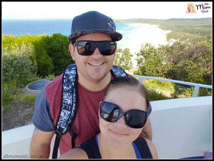 adventure couple at Seal Rocks light house | view of ocean