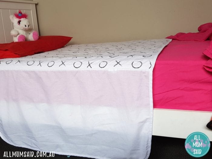 Brolly Sheets bed wetting sheet untucked on bed showing wings