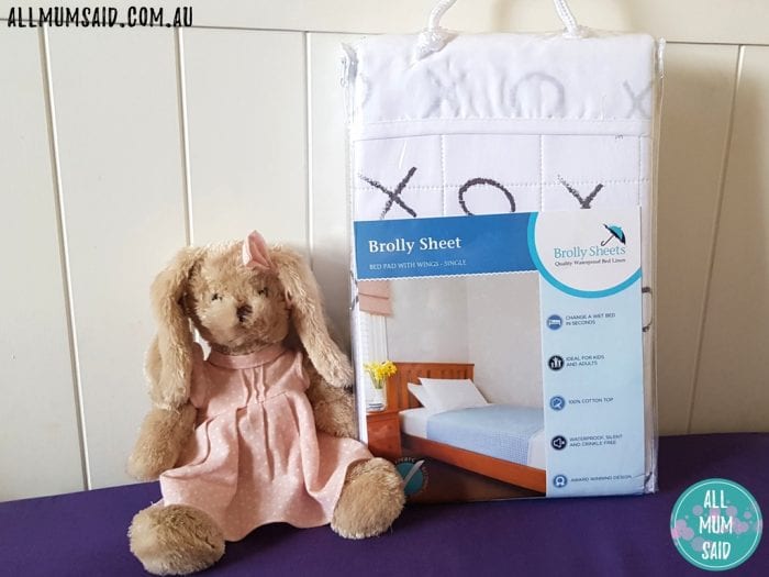 Brolly Sheets in pack on bed with plush bunny